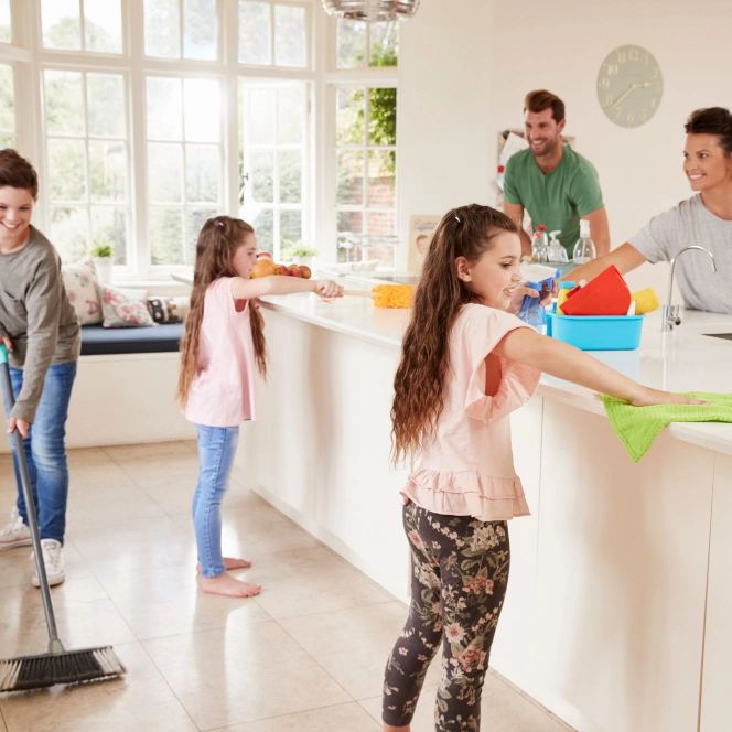 family in the kitchen helping eachother