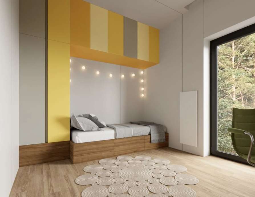 Bright second bedroom with yellow accents suitable for a child.
