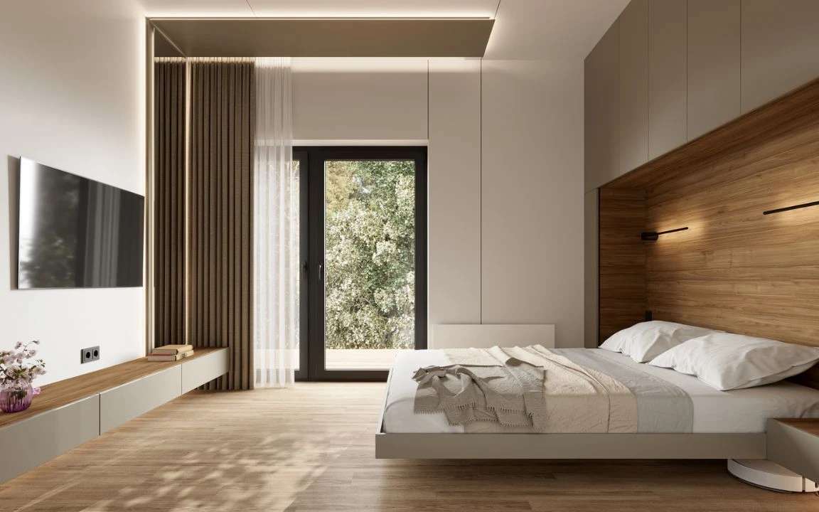Modern minimalist bedroom featuring a floating bed with wood accent wall, built-in lighting, and a large window overlooking greenery.