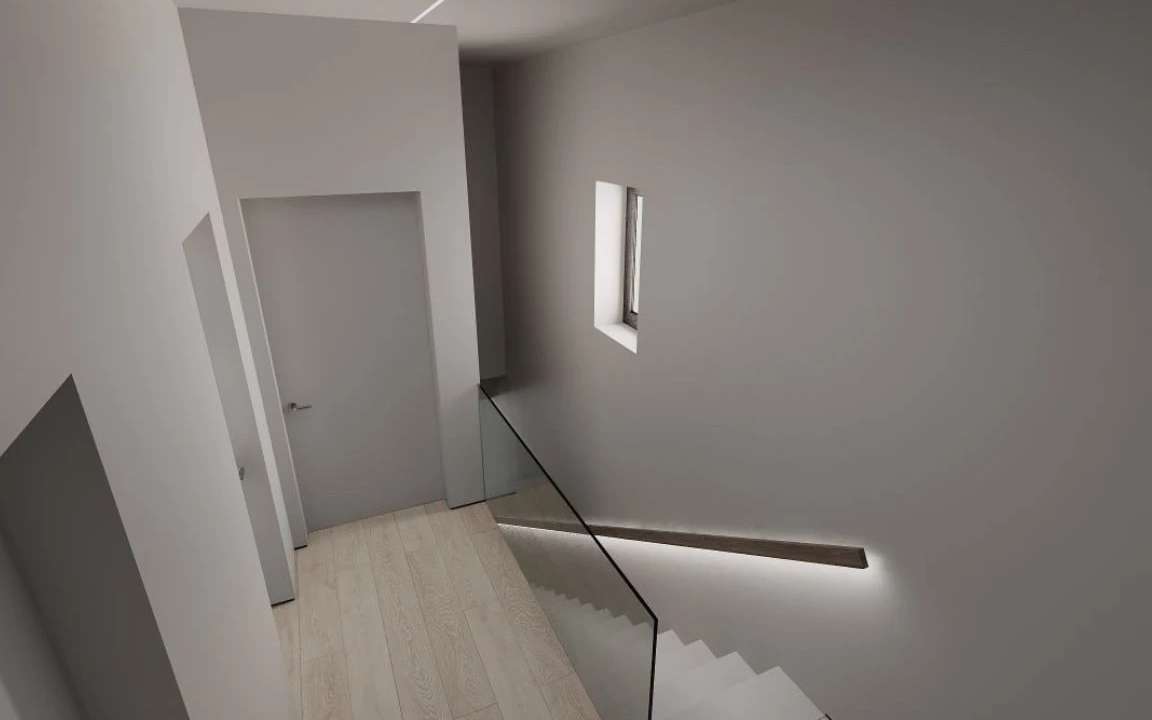 Minimalist stairwell with glass balustrade, ambient lighting, and narrow window
