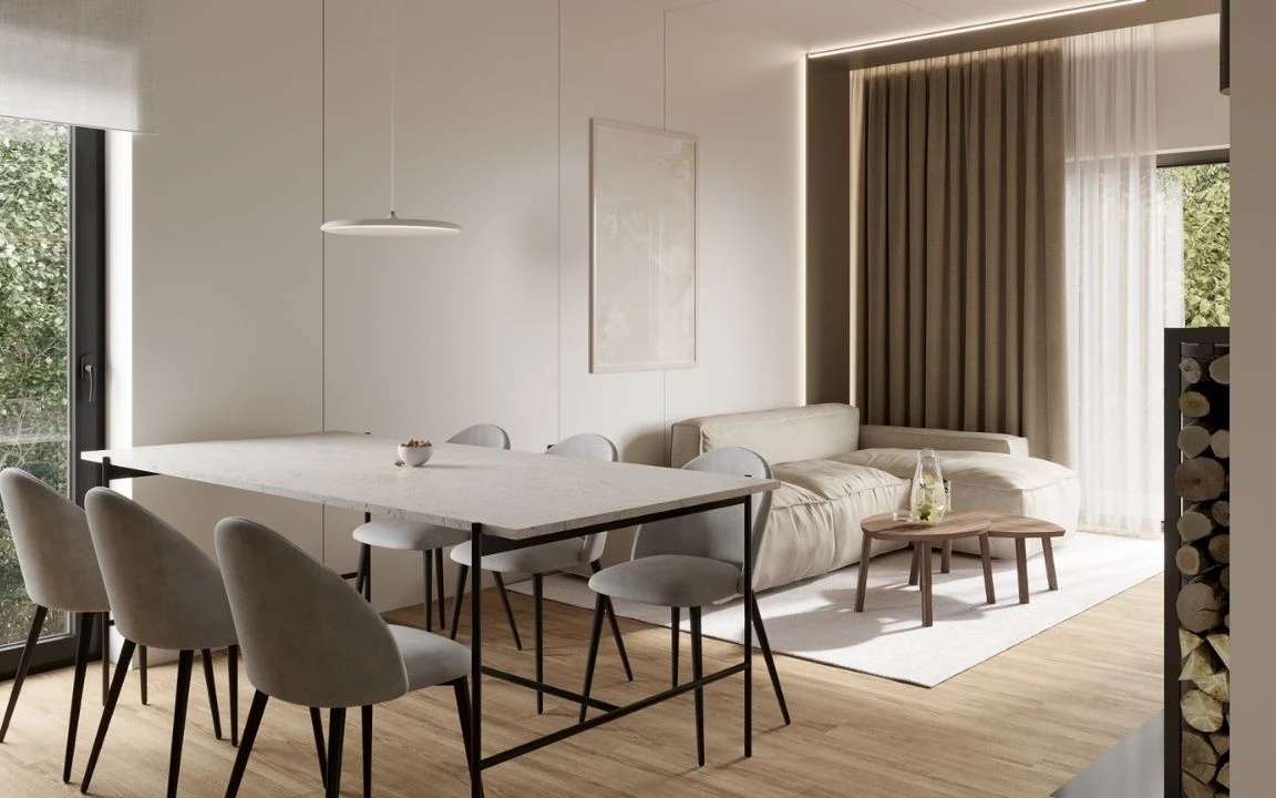 Bright open-plan dining and living room with soft neutral tones and natural light
