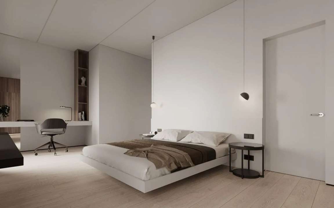Guest bedroom with floating bed, wall desk, warm tones, and pendant lighting