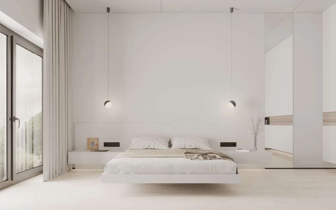 Front view of modern bedroom with symmetrical pendant lighting and neutral tones