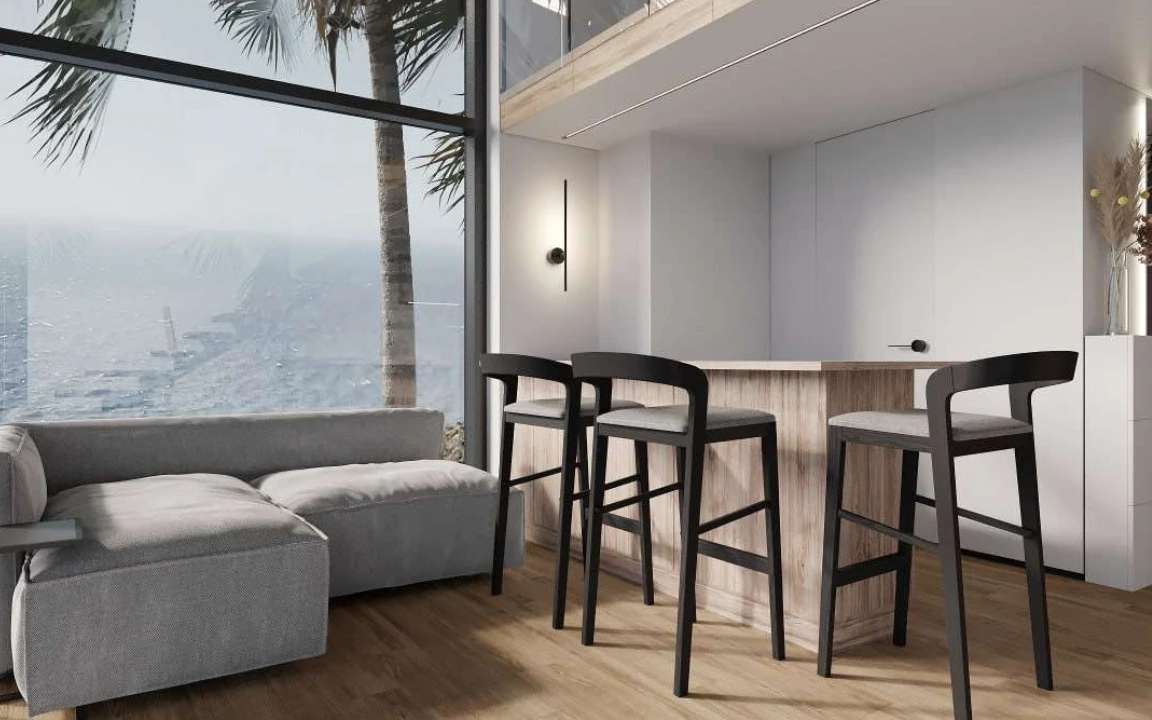 Modern kitchen setup in the  modular house with wood accents and ocean view