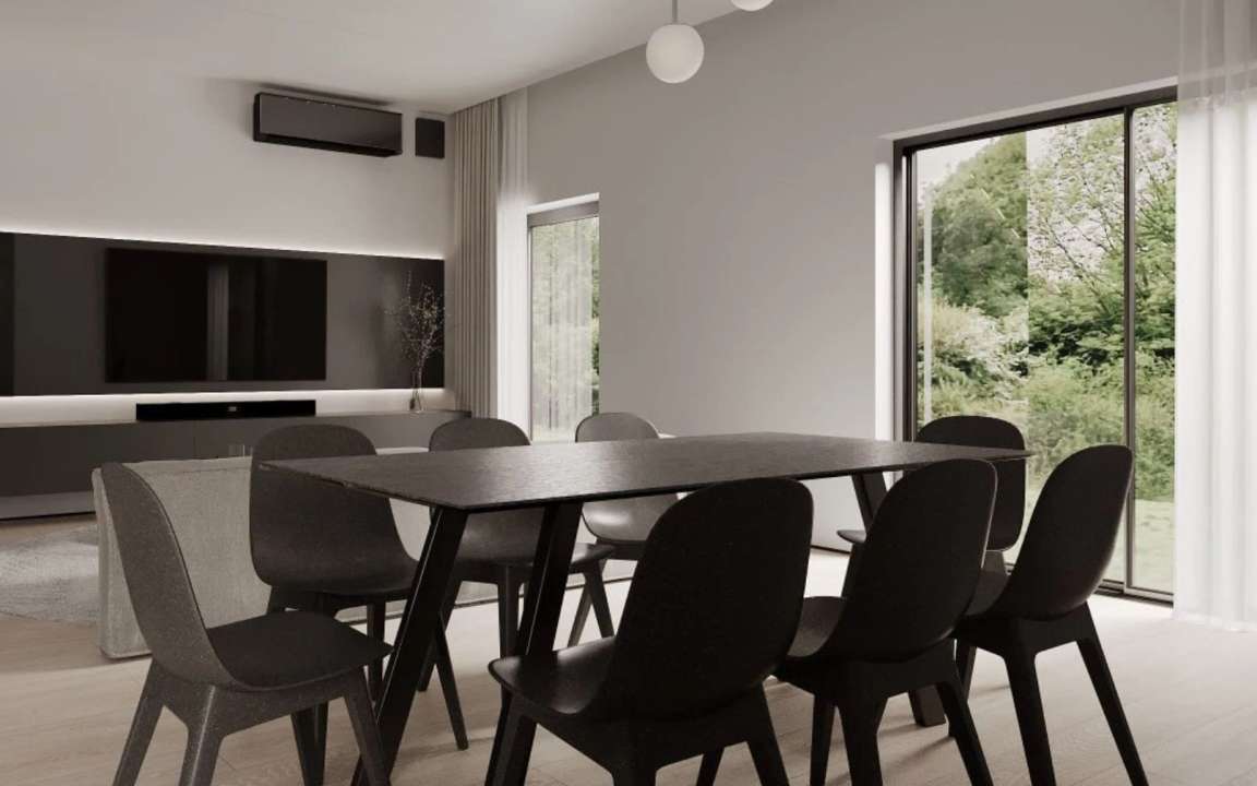 Dining area with the living room as background
