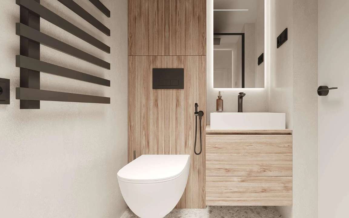 Shower area of the  modular house with glass door and black accents