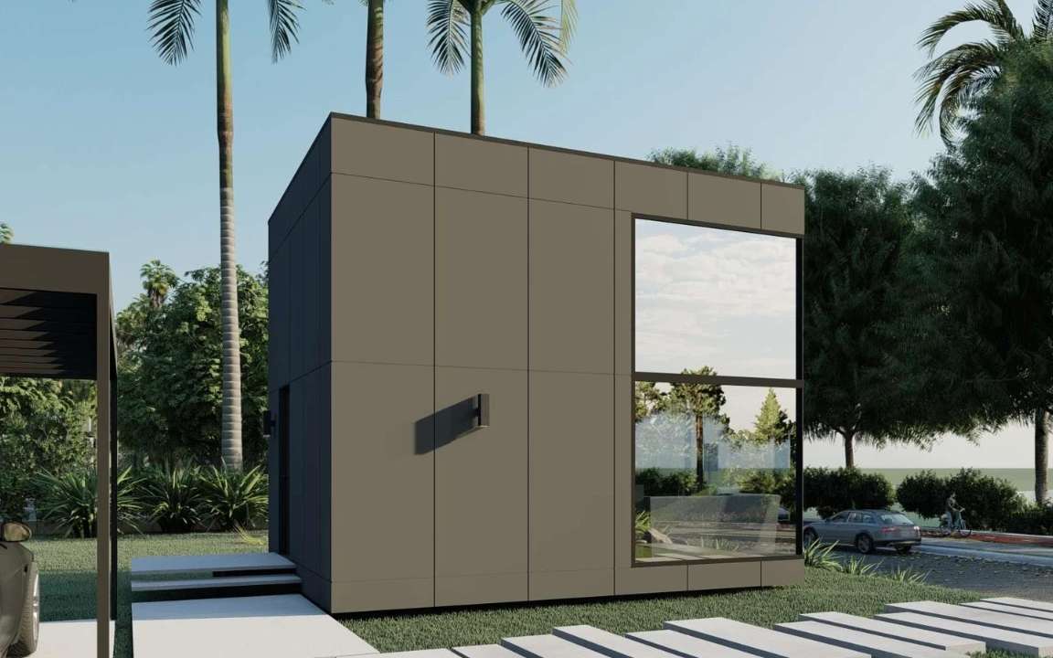Rear view of the  modular house with glass windows and patio