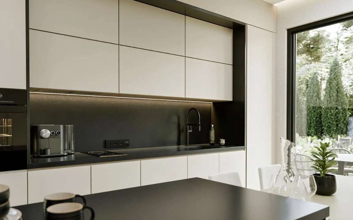 view of the modern kitchen in a beige modular house, featuring sleek cabinetry, contemporary appliances, and a functional layout for efficient cooking.