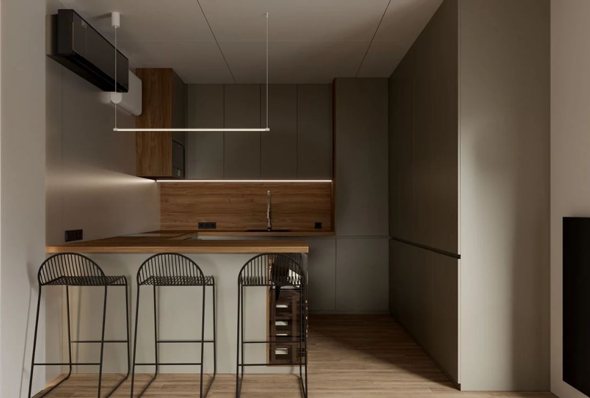 Modern minimalist kitchen with wood accents, built-in storage, and black bar stools