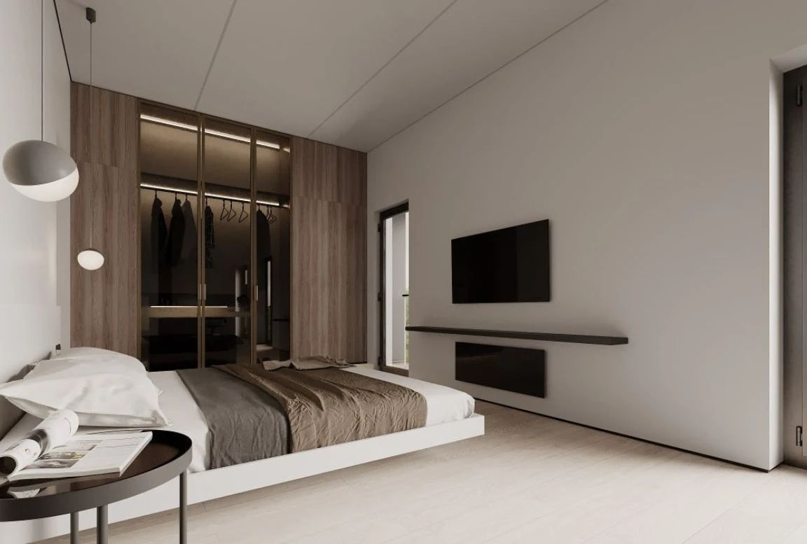 Bedroom with TV wall, floating bed, and built-in glass wardrobe with soft interior lighting