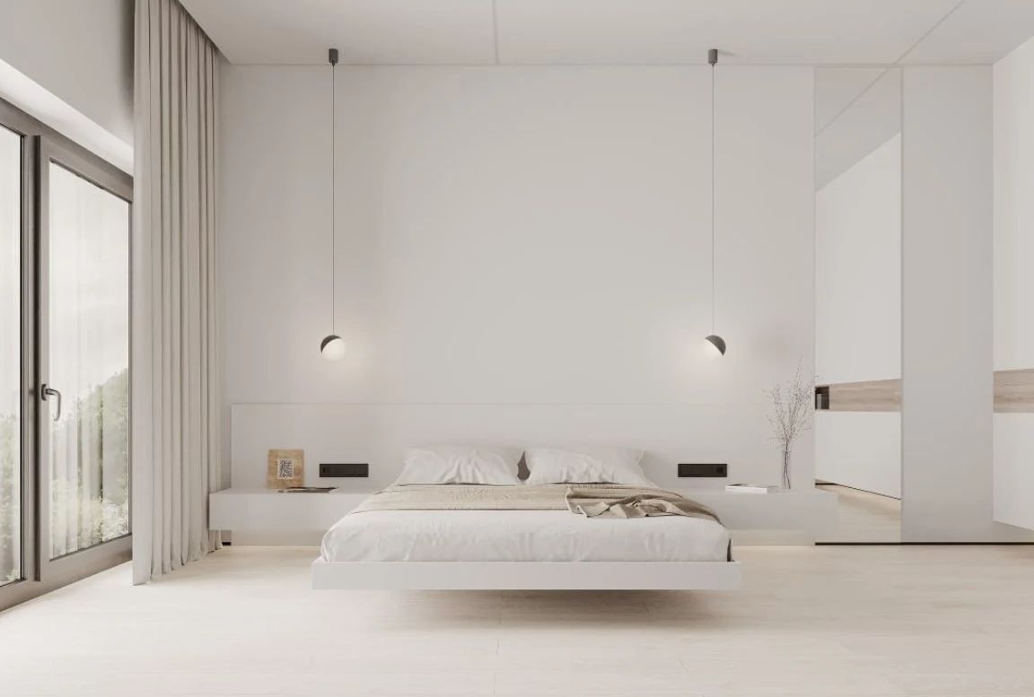 Front view of modern bedroom with symmetrical pendant lighting and neutral tones