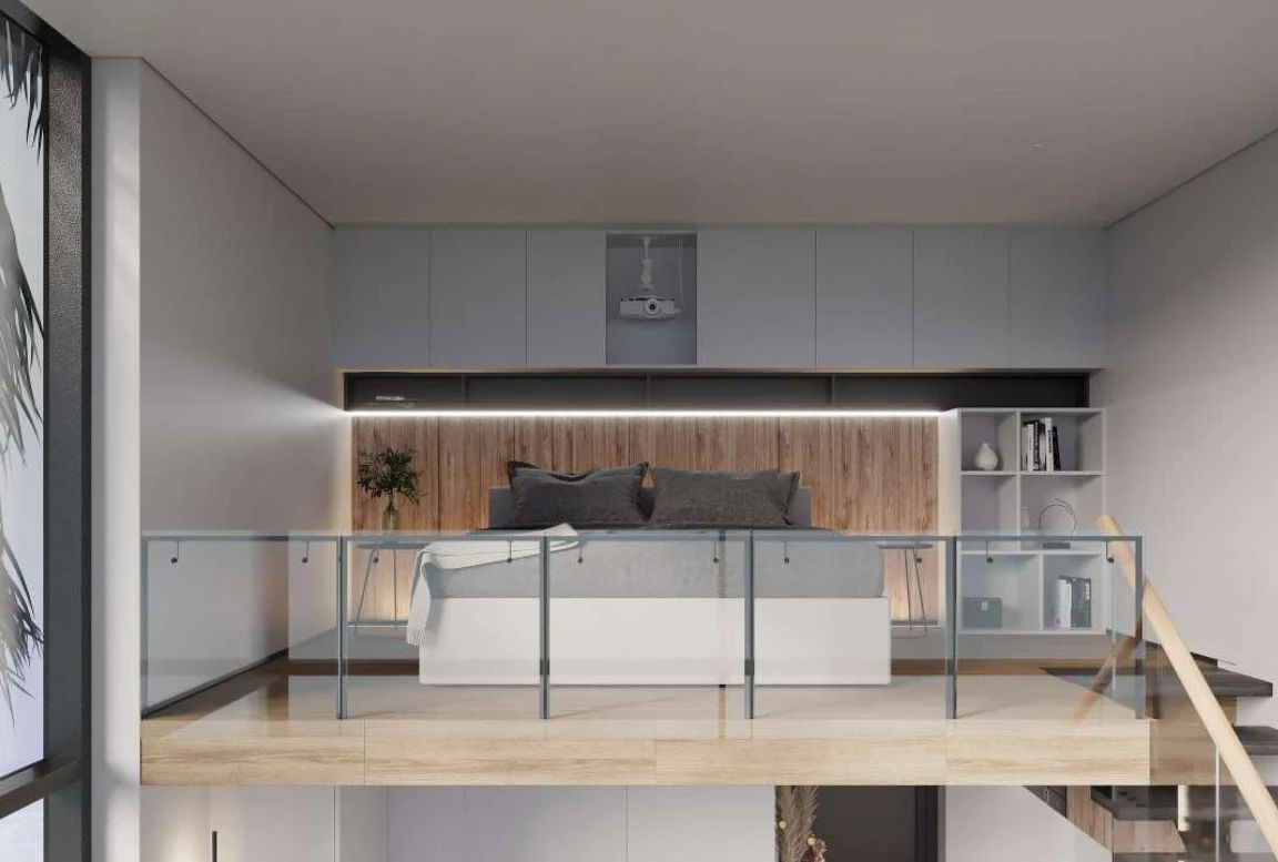 Cinema setup in bed with a projector in the  modular house