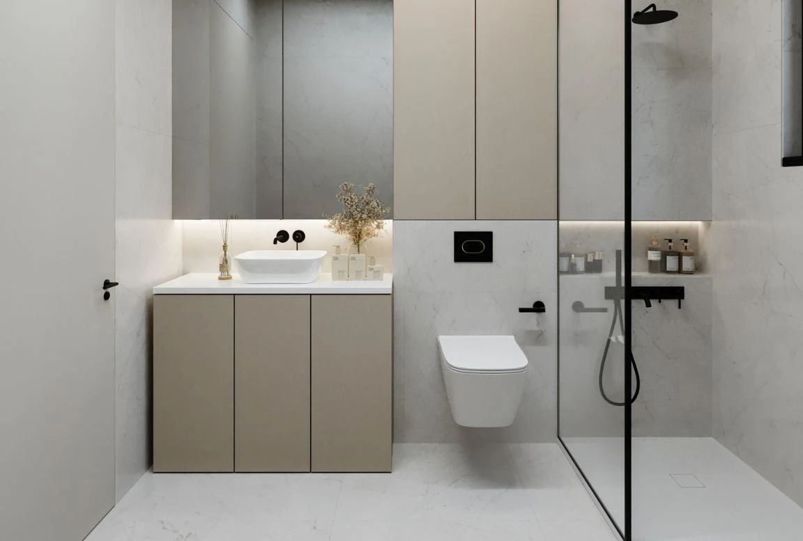 view of the stylish bathroom in beige modular house, highlighting modern fixtures