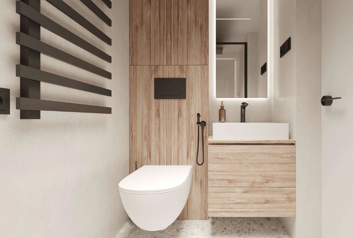 Shower area of the  modular house with glass door and black accents