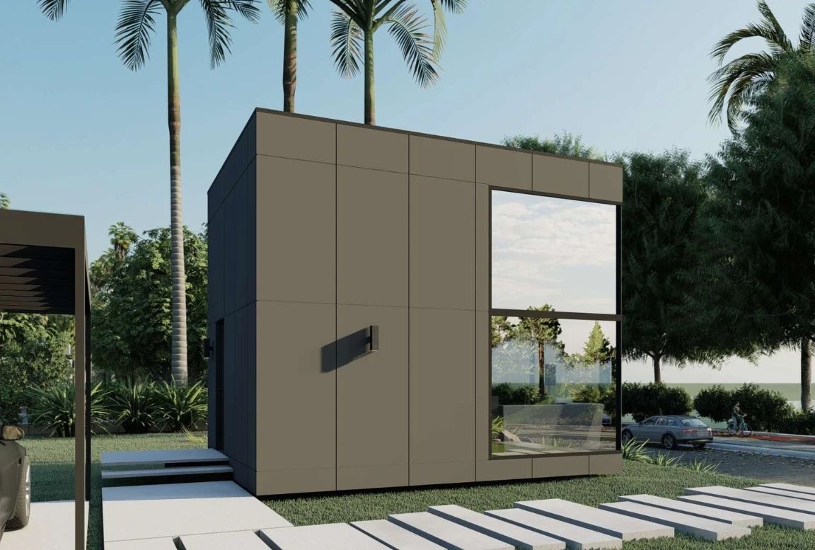 Rear view of the  modular house with glass windows and patio