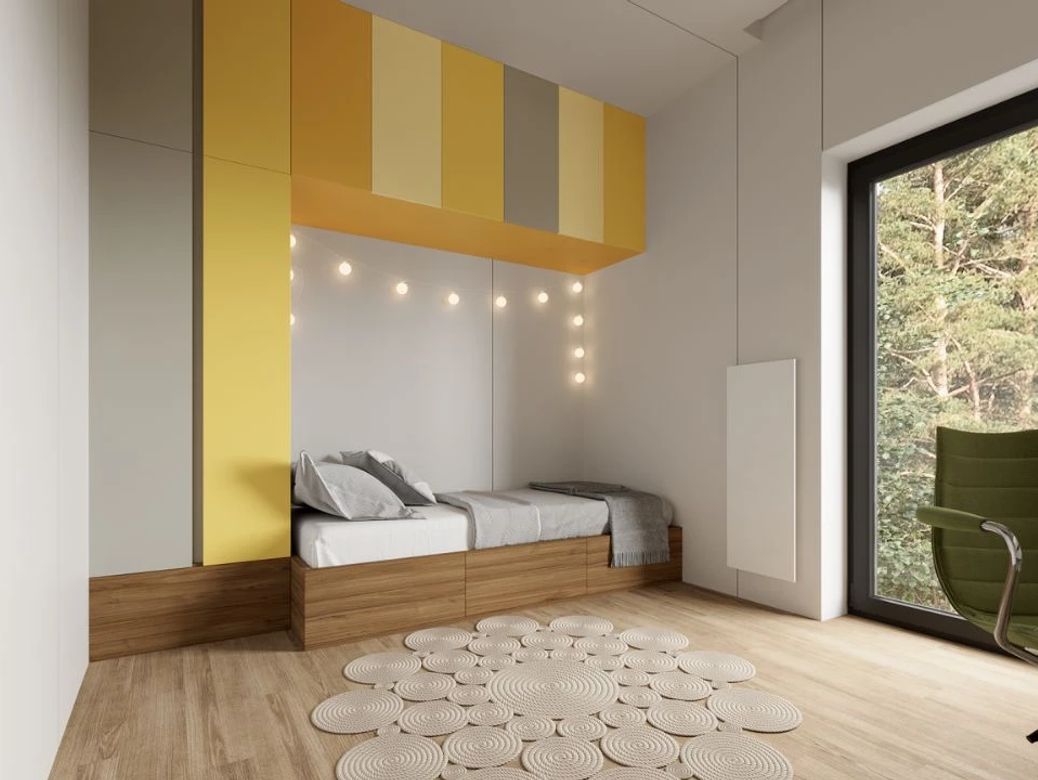Bright second bedroom with yellow accents suitable for a child.